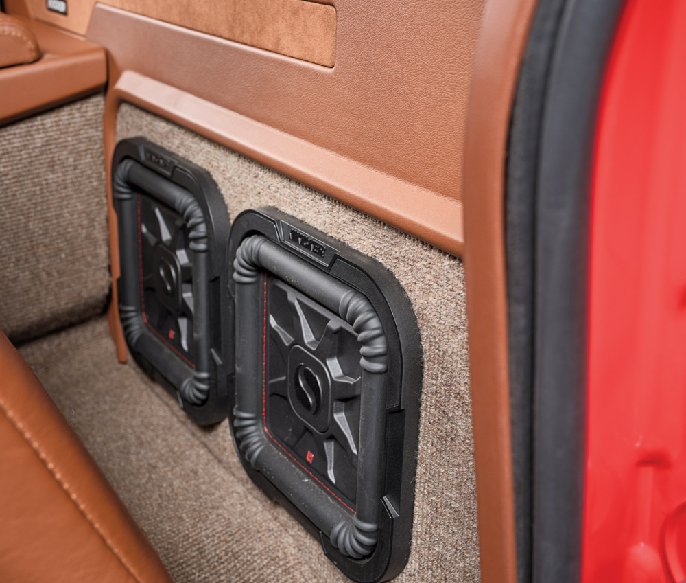 1996 Chevy truck audio build with dual Kicker Solo-Baric square subwoofers behind the seats