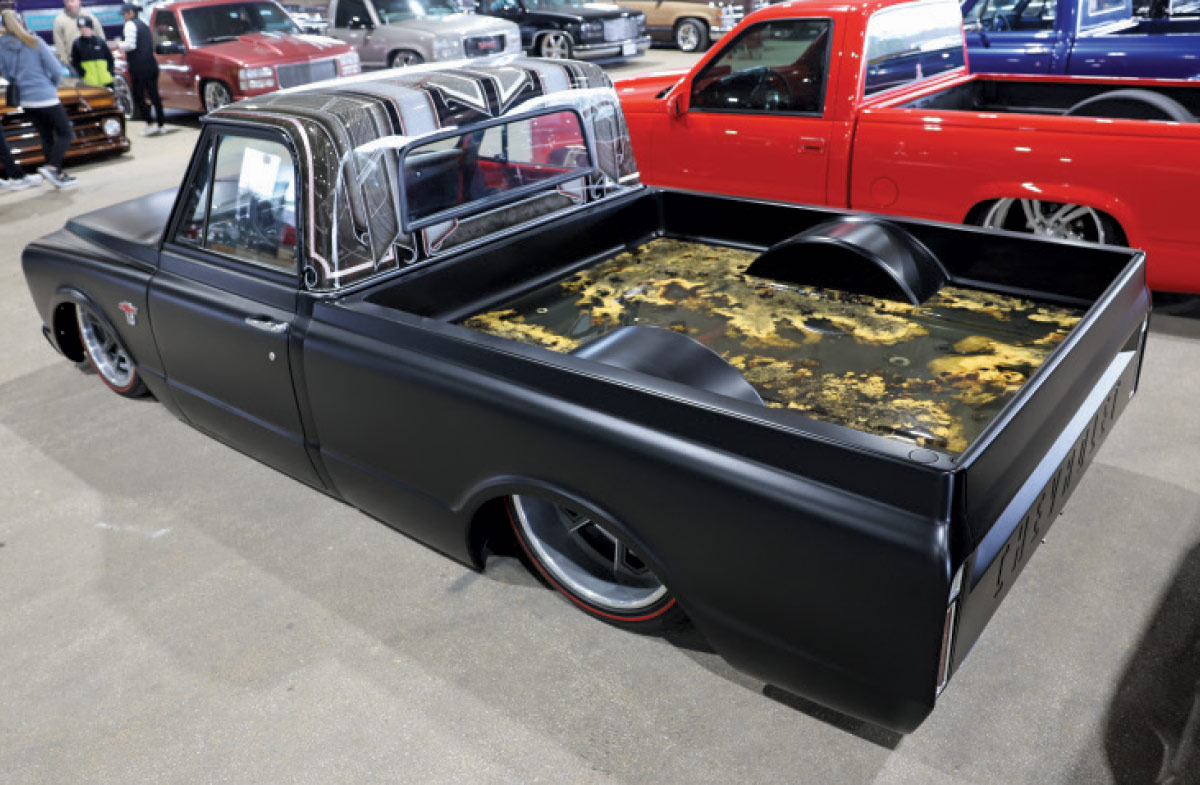 1966 Chevrolet C10 in matte black with candy patterned roof and custom epoxy glass bed floor