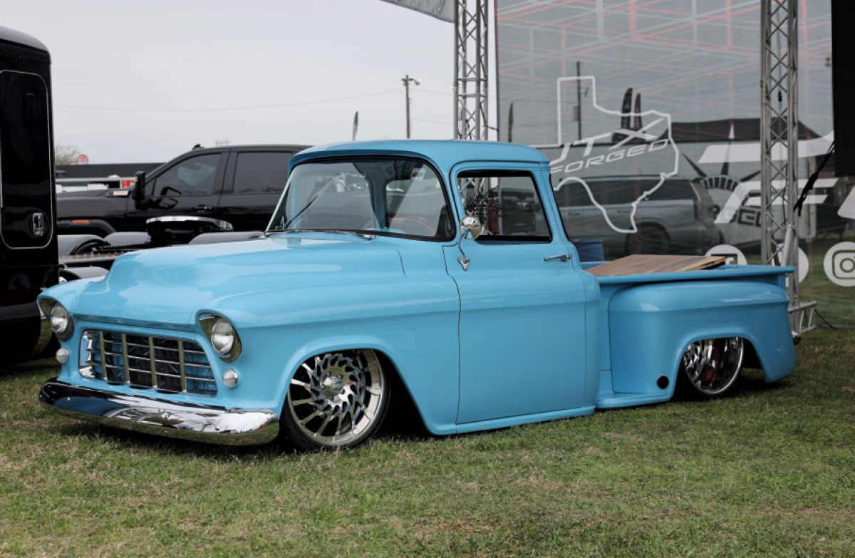 1955 Chevrolet Task Force in baby blue with billet wheels and a smoothed bed floor
