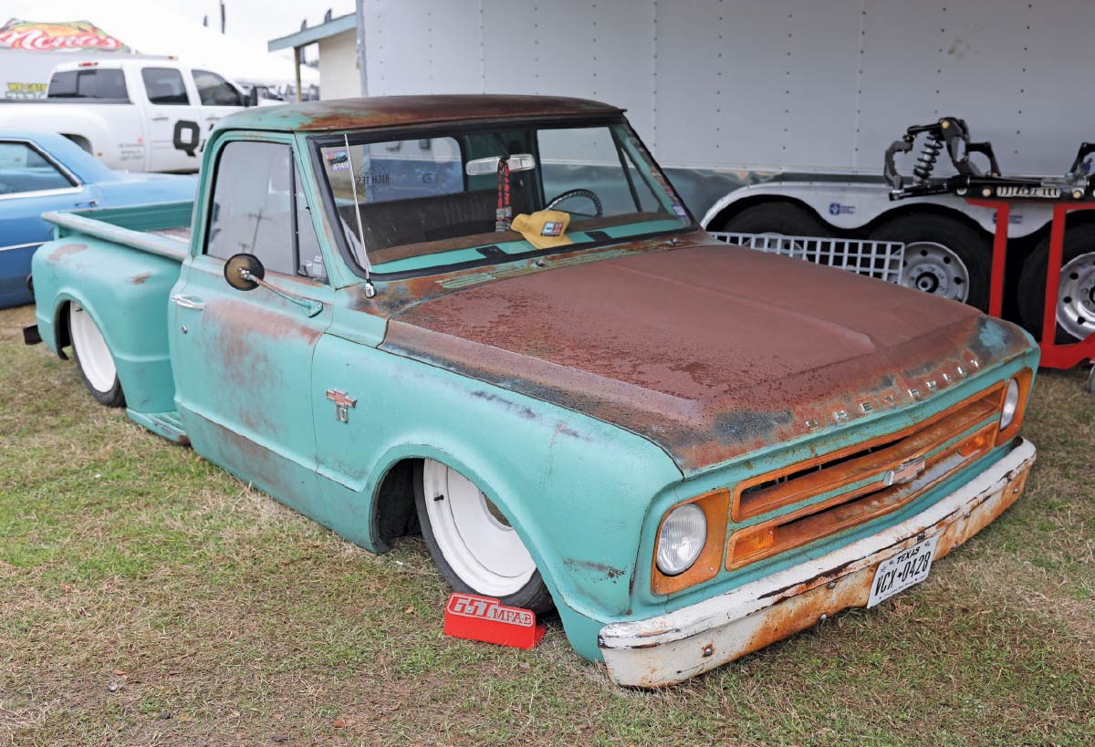 1968 Chevrolet C10 longbed with heavy patina, white steelies, and old-school shop truck presence