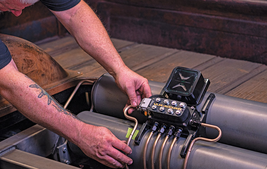 Fine-tuning copper line fitment into AccuAir VU4 block for clean install on Apache bed