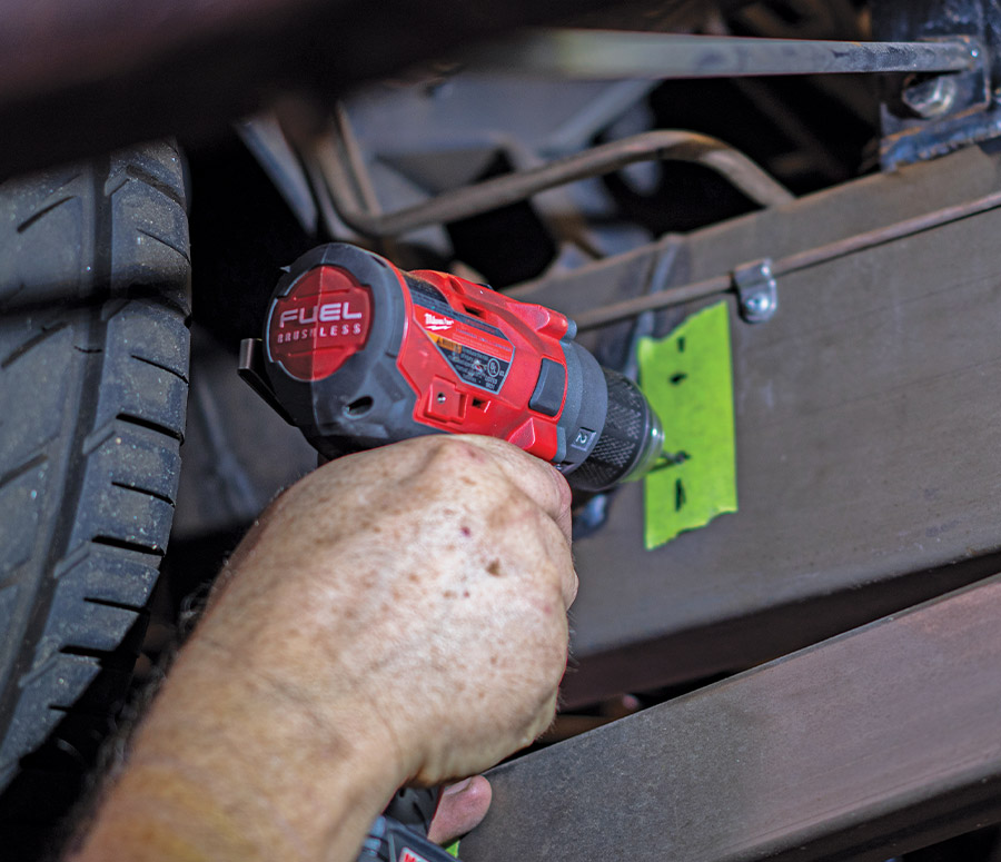 Frame being drilled with Milwaukee drill for mounting height sensor components