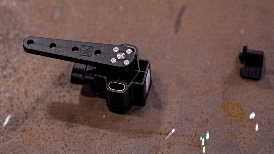 Fully assembled sensor and linkage arm ready for suspension articulation