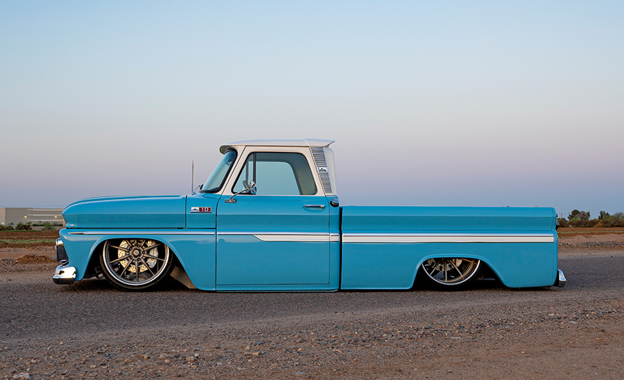 1965 Chevrolet C10 profile view slammed with polished wheels and trim
