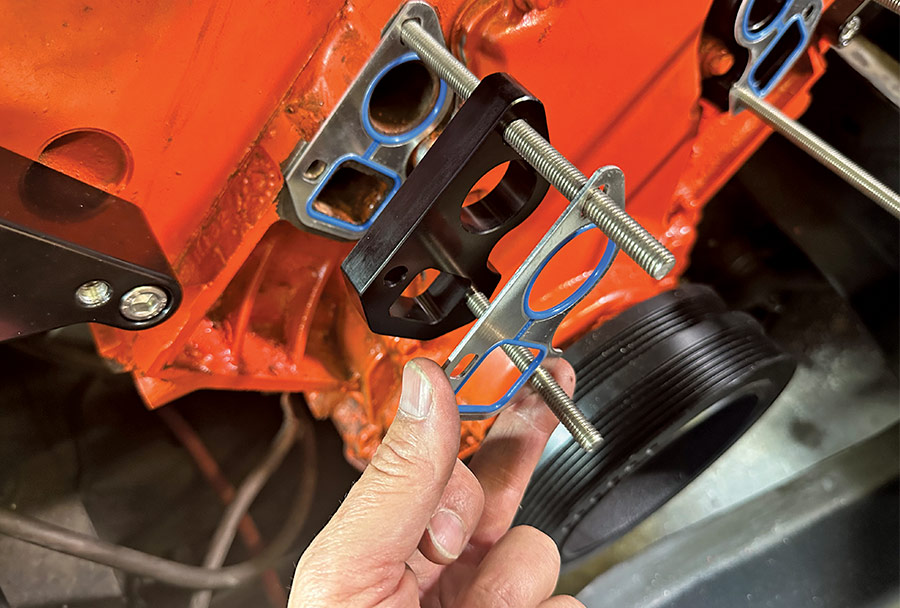 Coolant crossover and gaskets installed with water pump studs on LS engine block