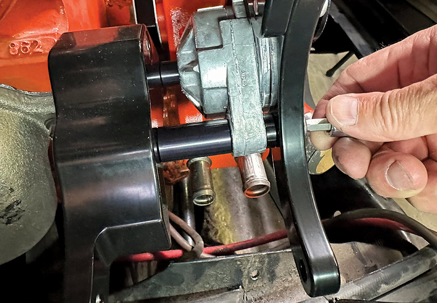 Power steering pump mounted using spacers between Billet Specialties bracket legs