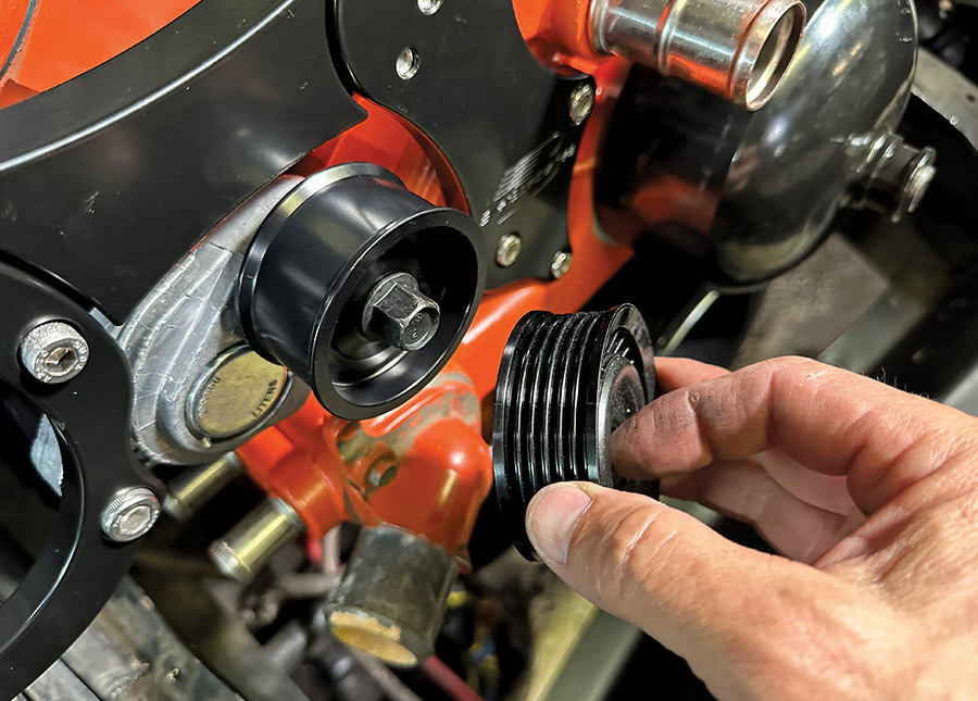 Idler pulley and crank-driven pulley being aligned for belt routing on LS block
