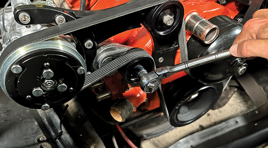 Belt tension being adjusted on completed Billet Specialties front drive system