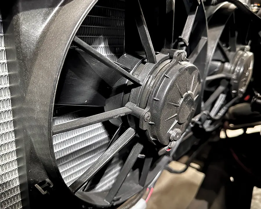 Dual SPAL electric fans mounted to shroud with deep-blade airflow design for optimal cooling