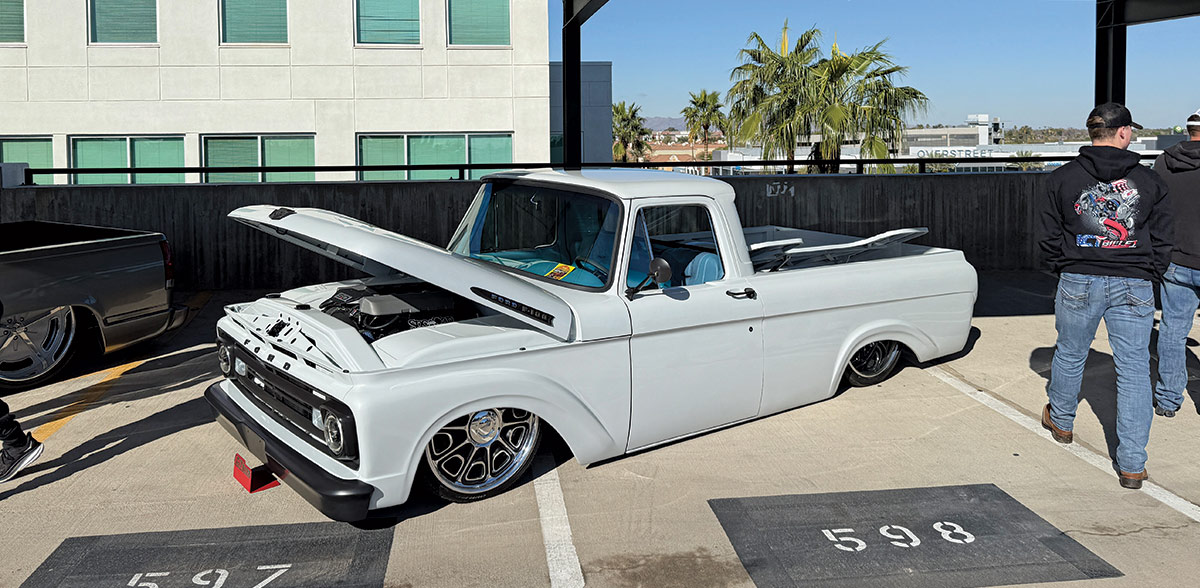 1963–1966 Ford F-100 bagged with 22-inch US Mags wheels and custom inner fenders
