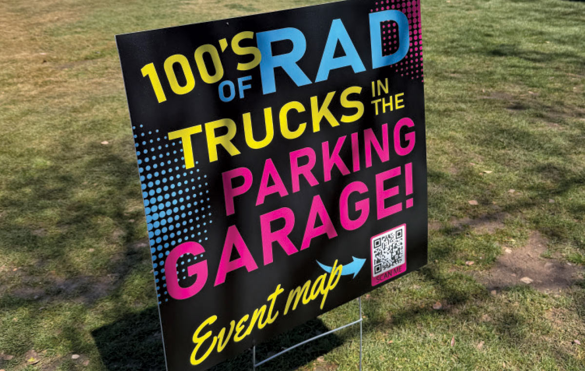 Event signage promotes hundreds of custom trucks inside Reunion show parking garage