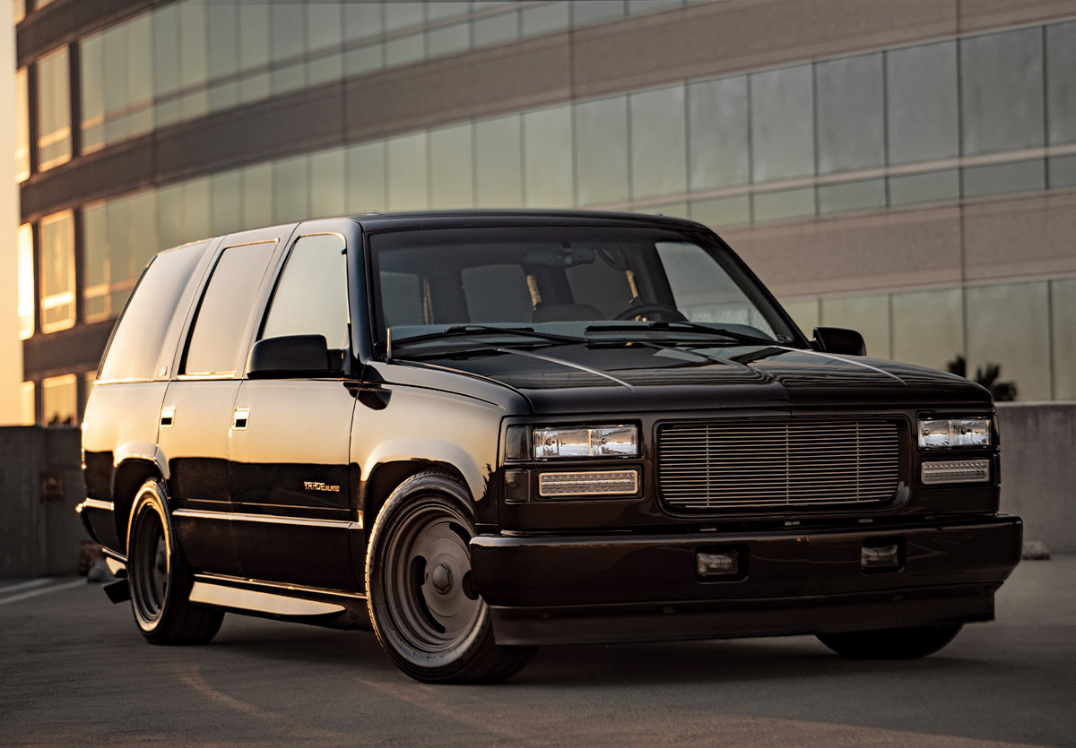 1996 Chevy Tahoe OBS with smoothed body, billet grille, and slammed stance on steel wheels