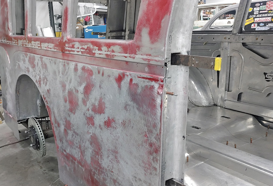 1938 Divco rear quarter panel body filler and sanding in progress