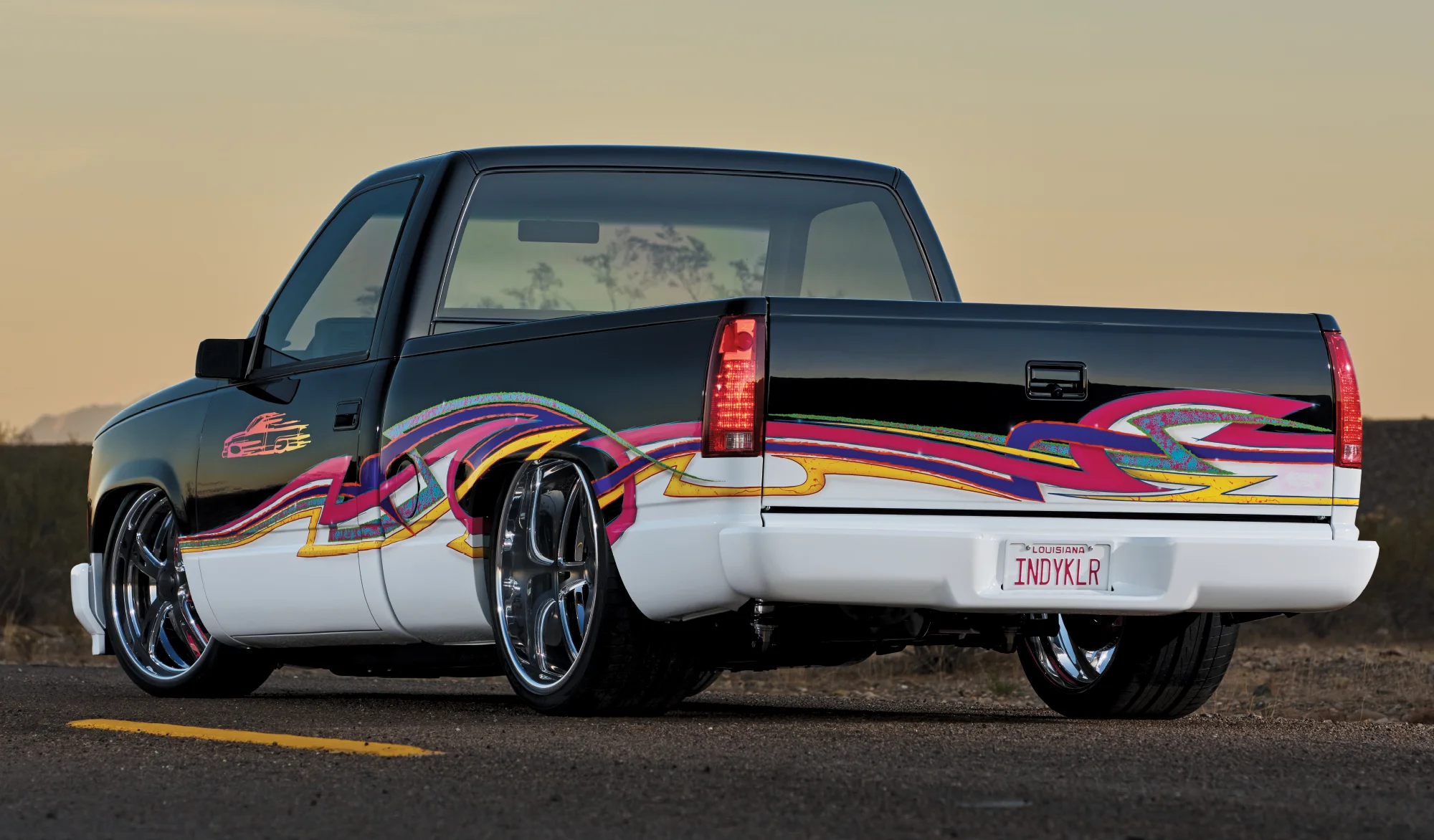 1993 Chevy OBS full custom with air suspension, billet wheels, and vibrant 90s-style show truck engine bay detailing