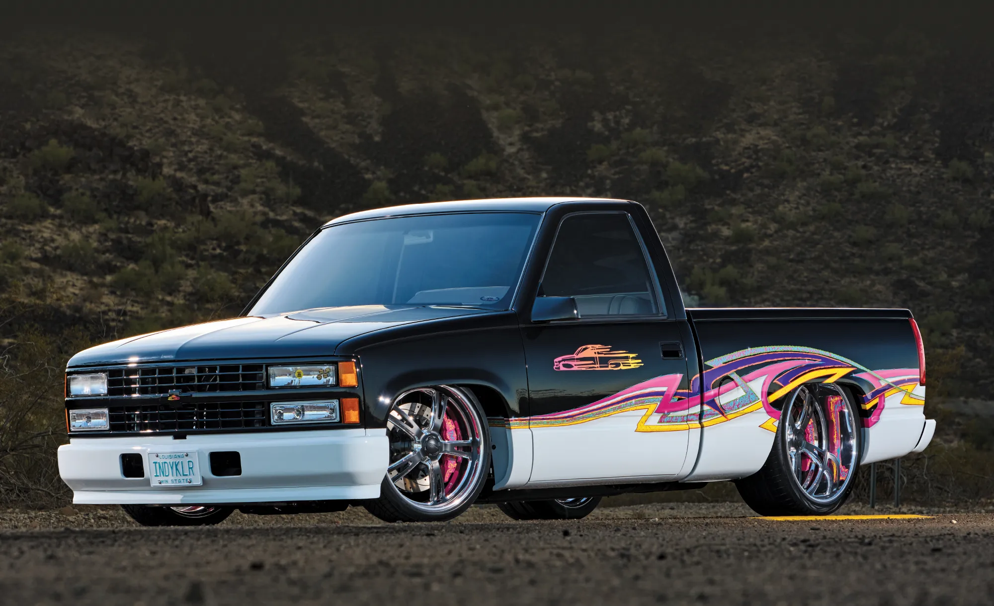 1993 Chevy OBS sitting low on staggered wheels with iconic '90s custom mini trucker vibe