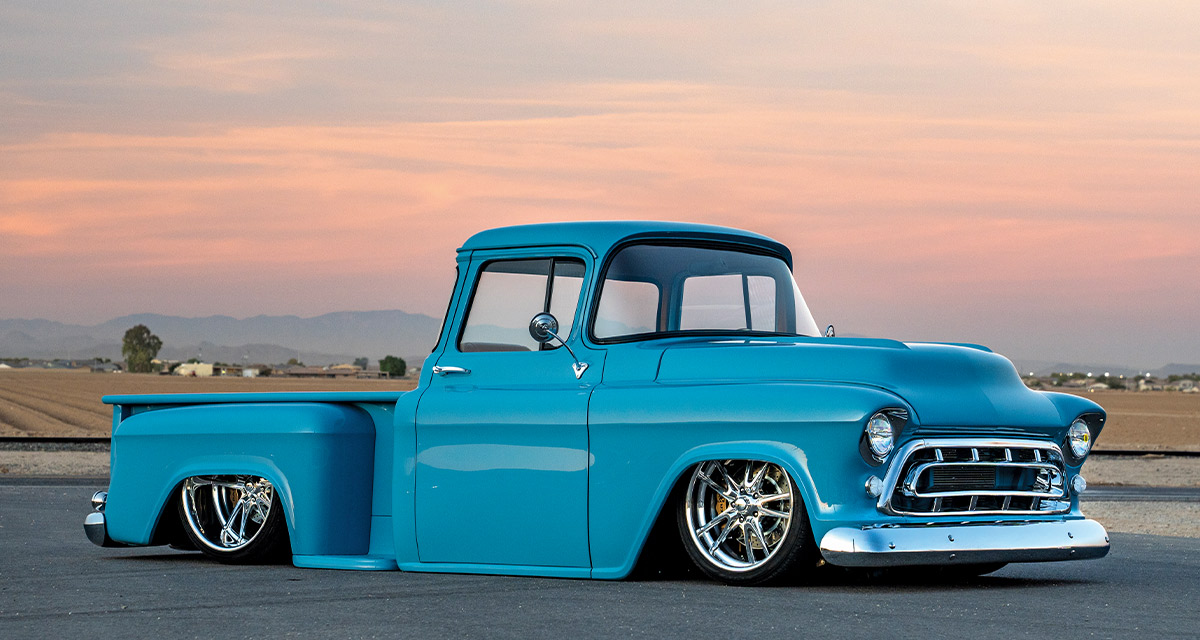 1957 Chevy truck custom air ride suspension slammed stance with billet wheels and turquoise paint