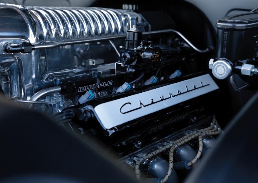 close up of Chevrolet decal on engine under hood