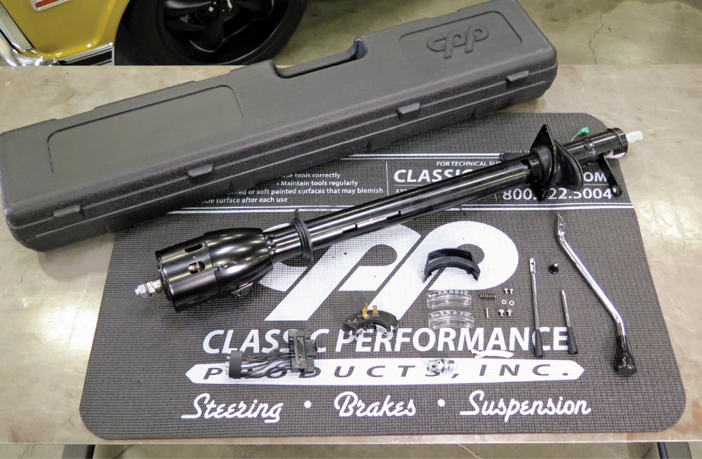 Shortened steering column kit with billet turn signal and tilt lever, installation hardware, and gaskets.