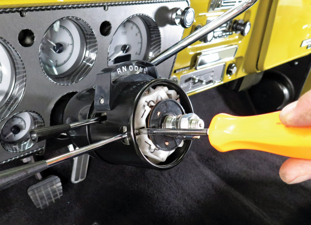 Steering column with the new turn signal and tilt levers installed.