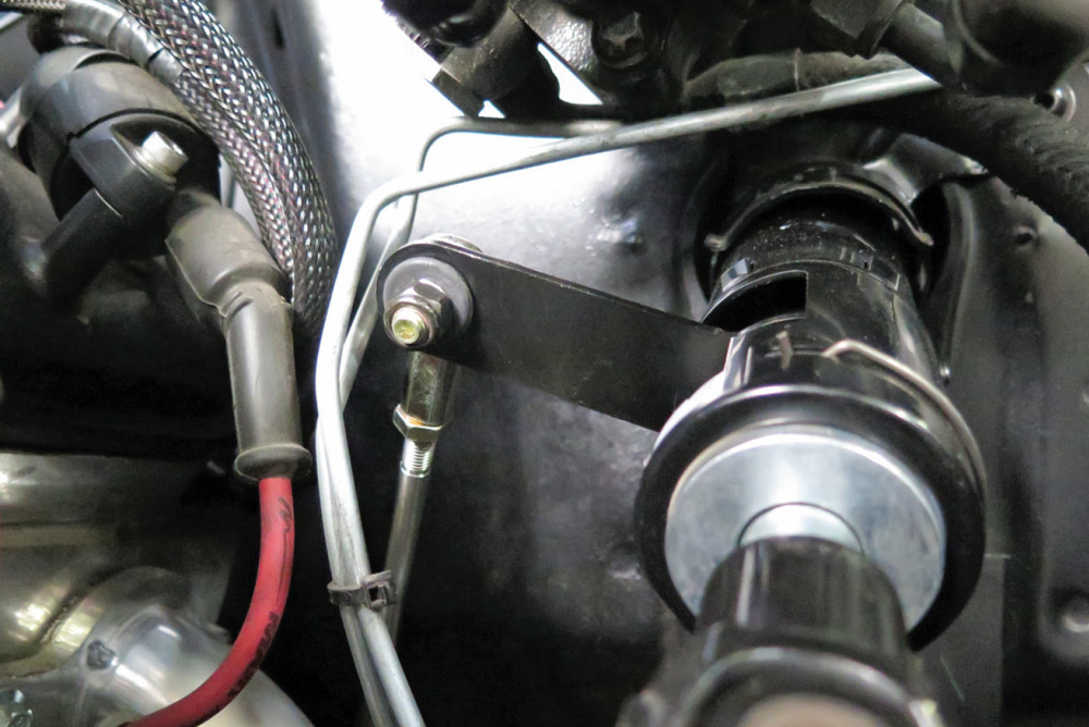 Adjustable rod end of the shift linkage attached to the steering column's shift arm.
