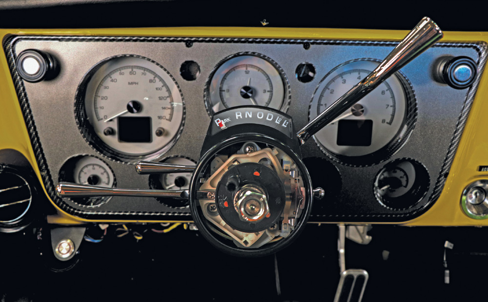 Dashboard with an installed steering column and illuminated gear position indicator.