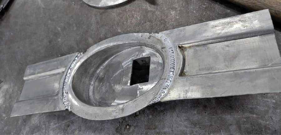 sections of metal with the beltline reveal added to the handle pocket