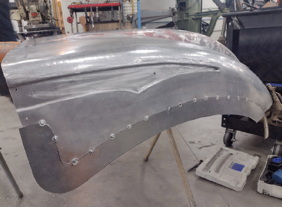 reveal being placed on the hood side and an additional strip of metal being added to the bottom edge