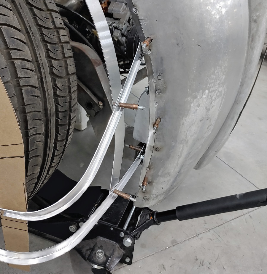 small pieces of angle contoured to make forms for shaping the front fenders