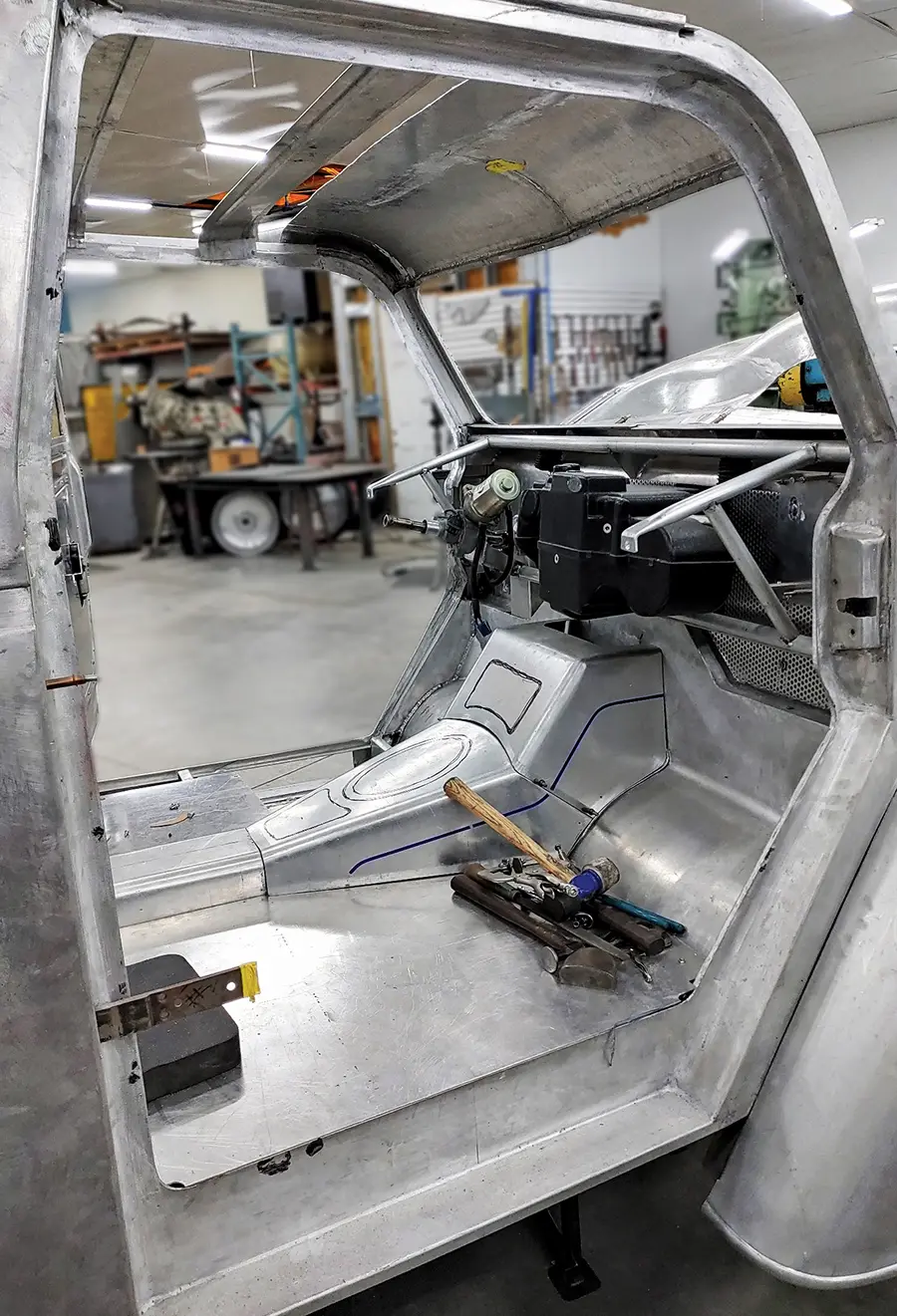 Divco custom interior bare floor and tunnel mockup with early dash bar and firewall detail