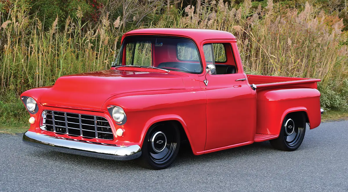 1955 chevy truck custom red paint lowered stance black hubcaps side profile