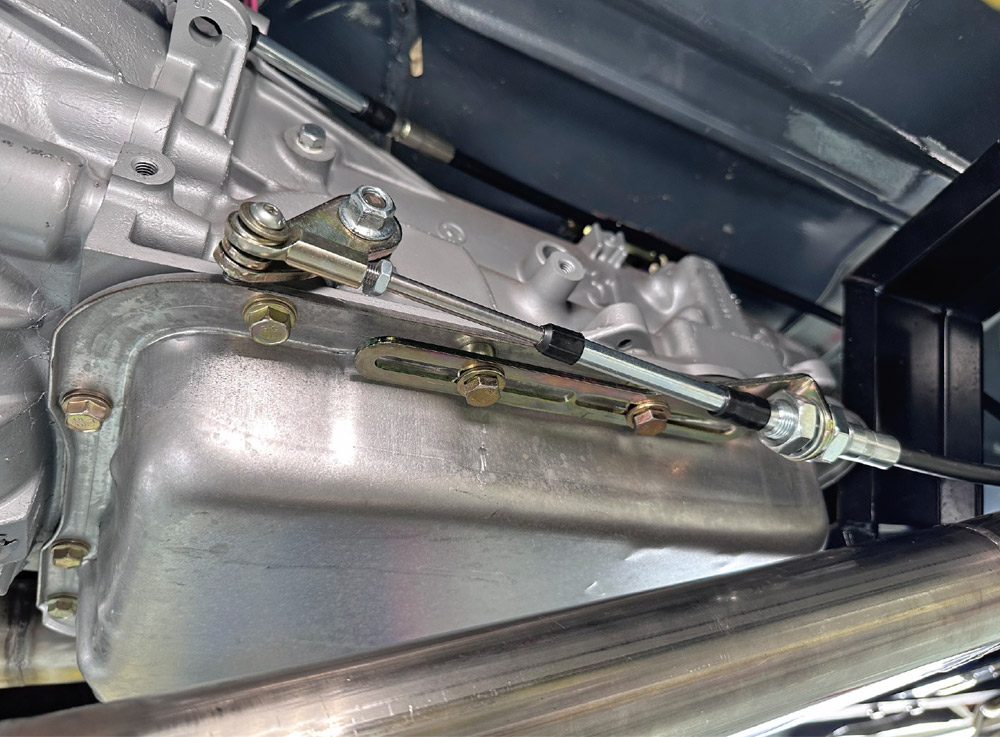 lokar transmission shift cable routed and secured with pan-mounted brackets