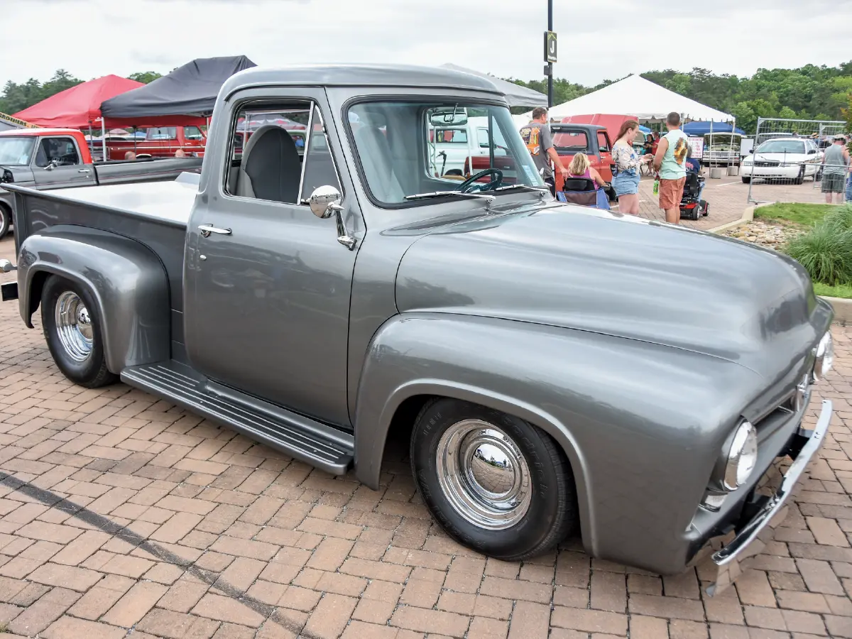 1955 ford f100 smooth gray custom with chrome smoothie wheels and subtle shaved details