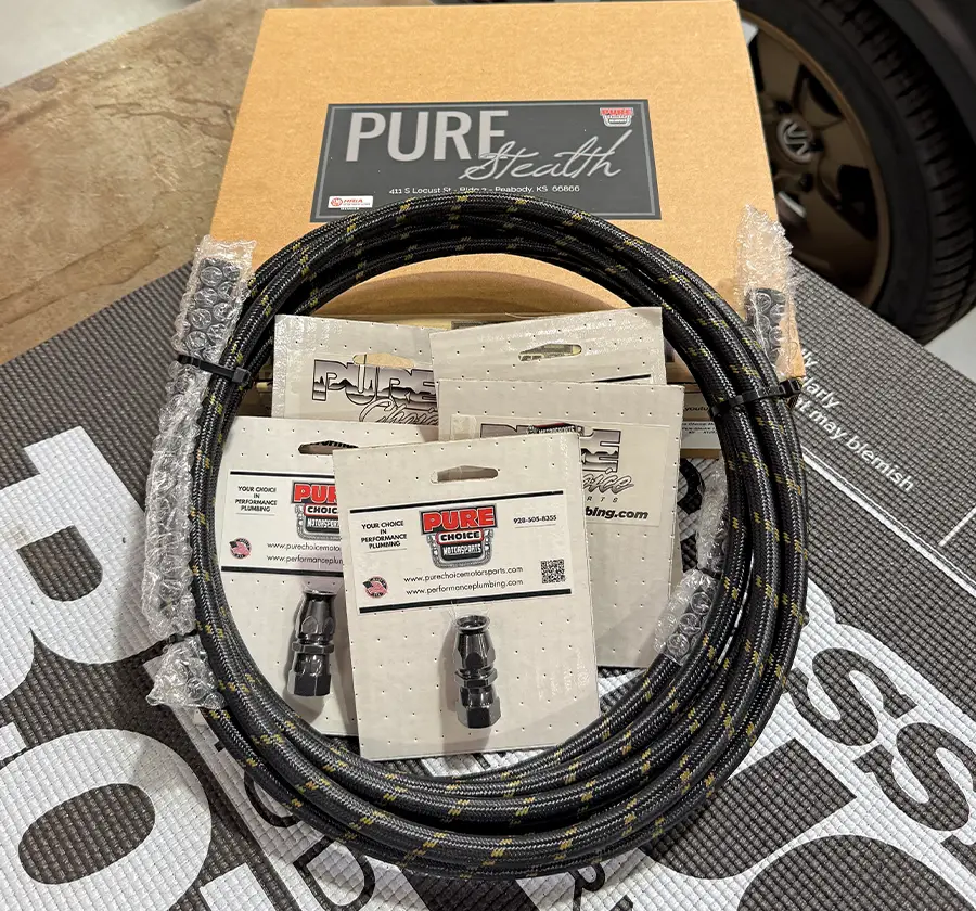 Pure Stealth transmission line kit complete braided hose fittings packaging