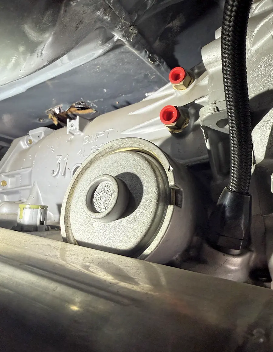 Transmission ports with red caps ready for Pure Stealth AN fittings install