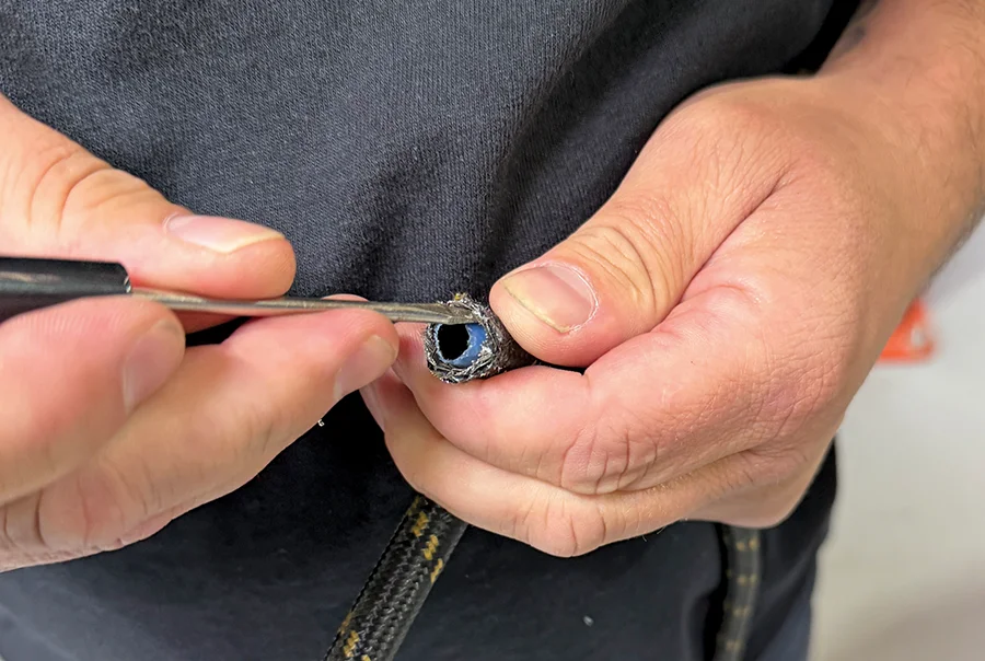 Deburring braided hose inner liner with pick tool for smooth fitting install