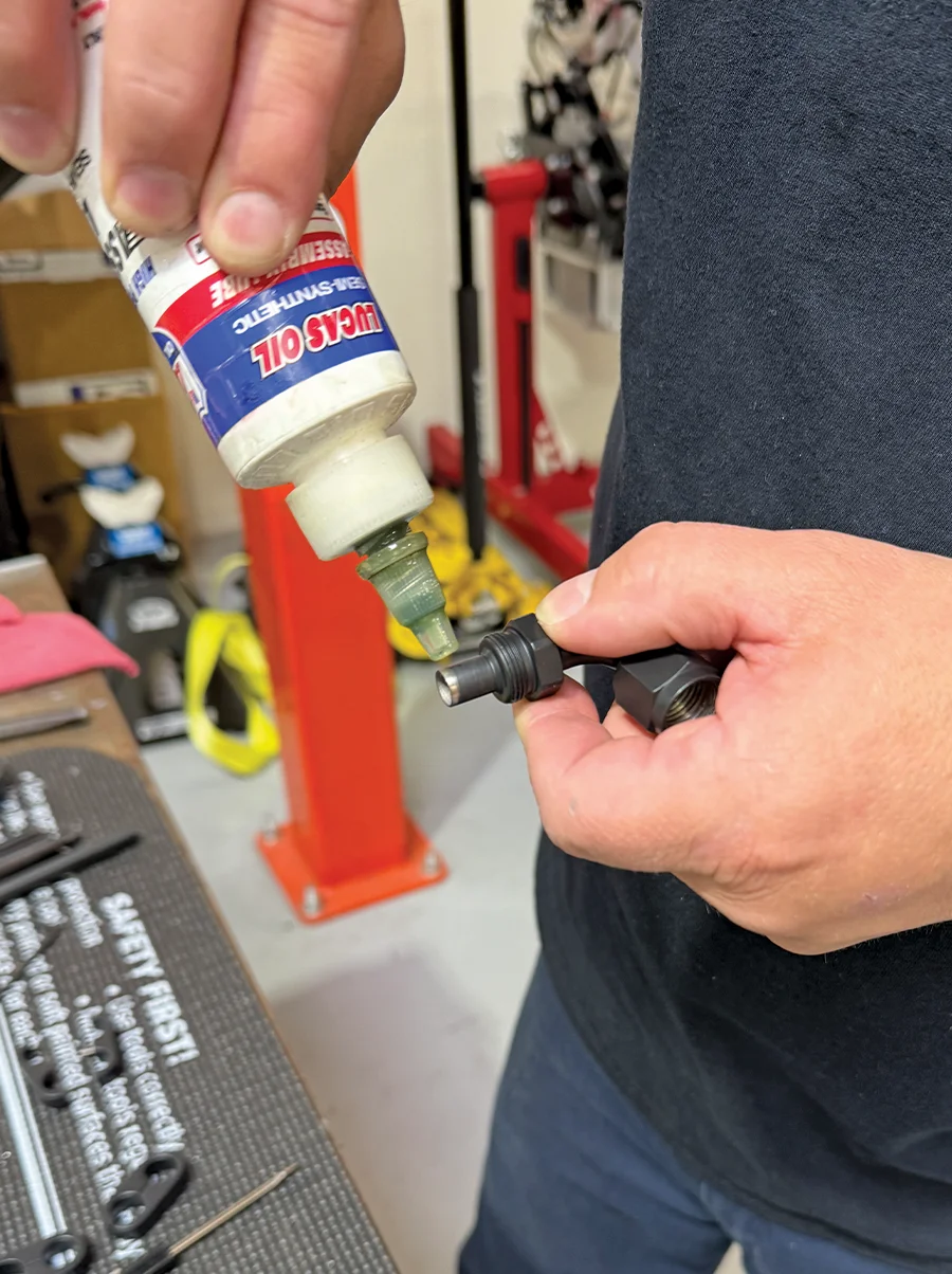 Lubricating AN fitting with Lucas Oil transmission fluid before insertion