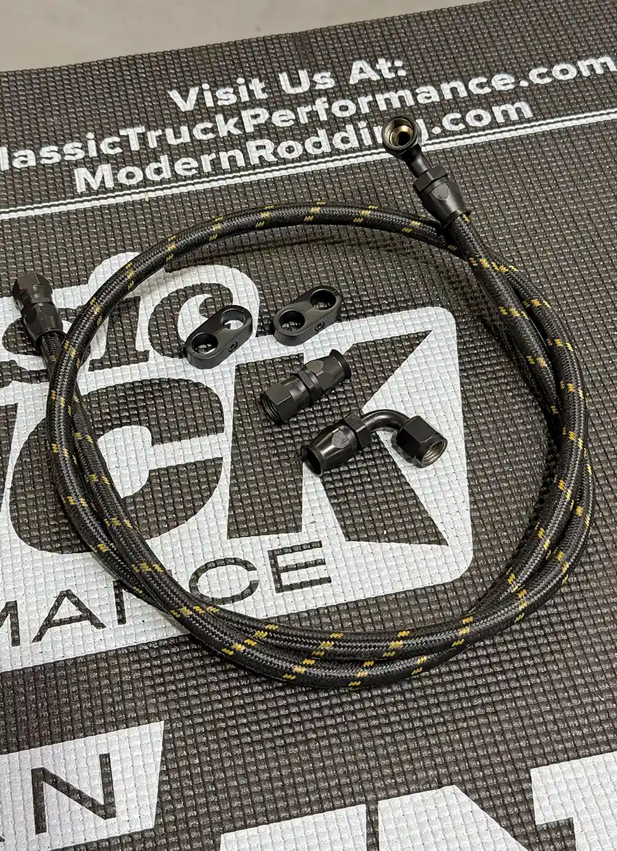 Finished AN braided transmission line with fittings and clamps on mat