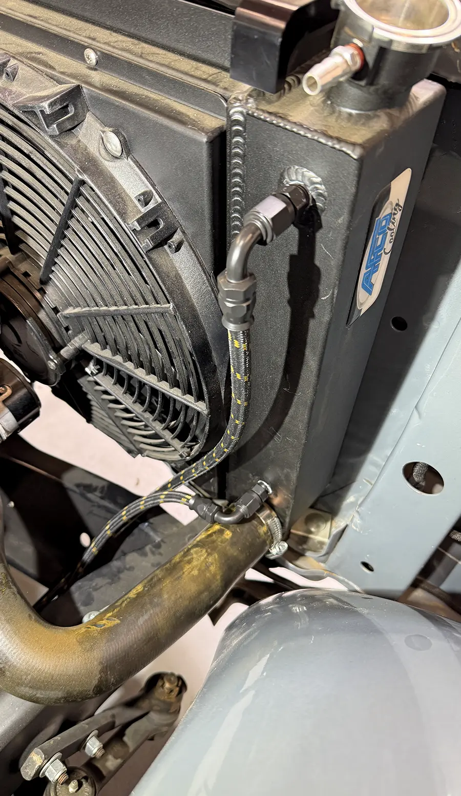 Completed AN line install at radiator with dual clamps and clean routing