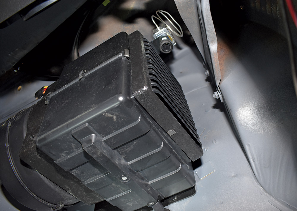 1951 Chevy AC floor vent grille mounted to underdash HVAC housing interior view