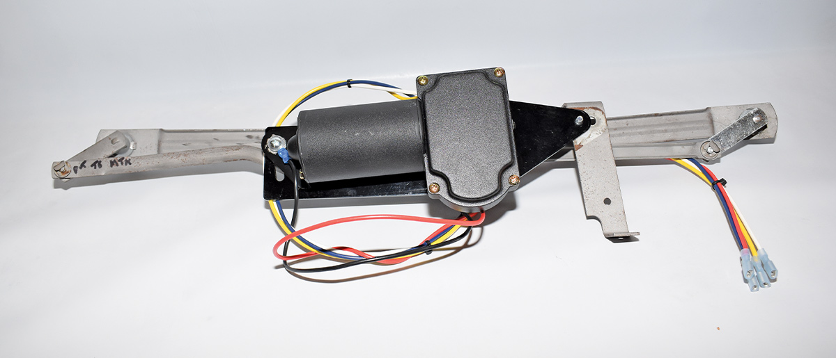 Wiper motor bracket with colored wiring installed