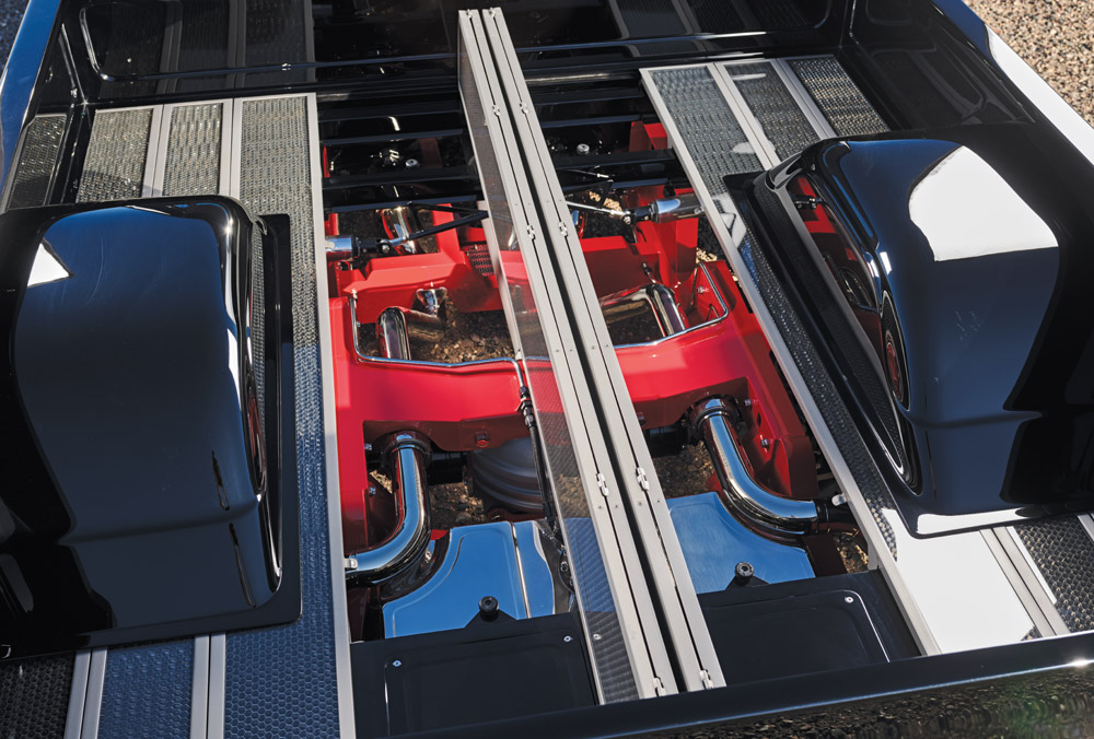 C10 bed floor removed, red frame, chrome exhaust, suspension components