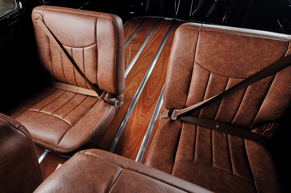 1952 Chevy Suburban second row seats, tan leather, woodgrain floor, seat belts, black metal trim