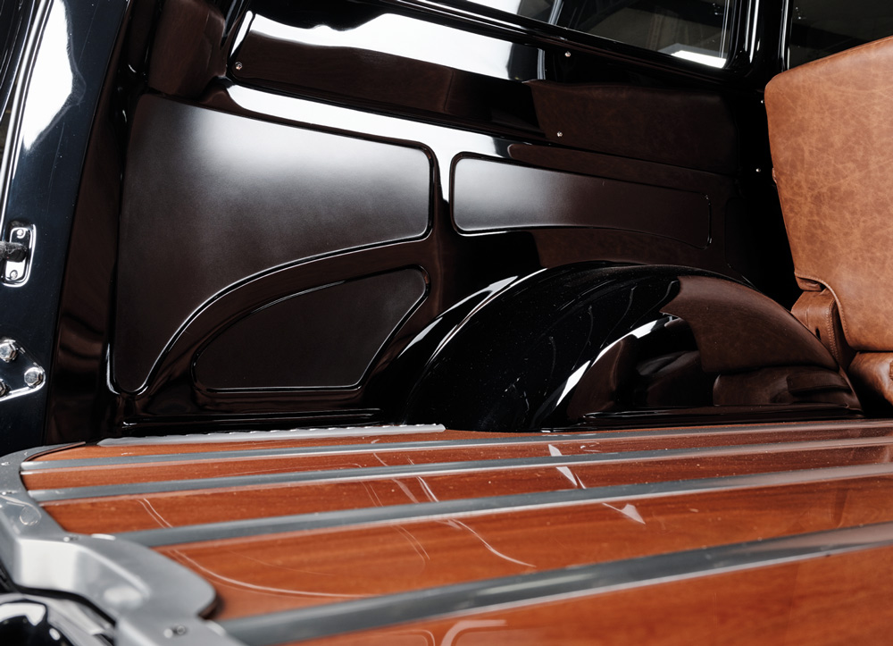 1952 Chevy Suburban rear cargo detail, wood plank floor, polished strips, black interior panels
