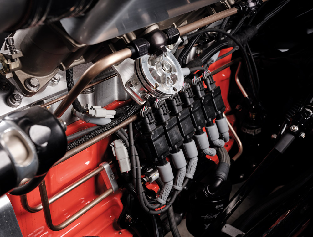1952 Chevy Suburban engine detail, red block, fuel injectors, wiring, polished rail, braided lines