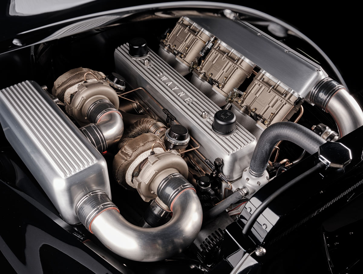 1952 Chevy Suburban engine, twin turbos, gold heat wrap, three throttle bodies, WAYNE valve cover