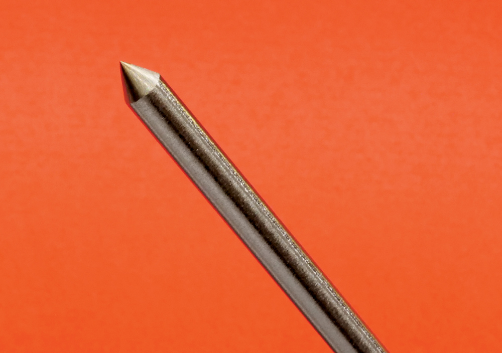 TIG tungsten electrode, fine point, slight angle, orange background