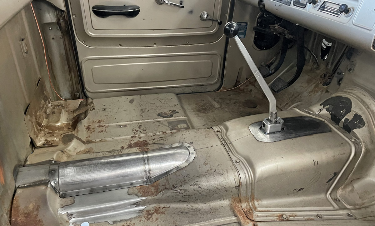 Interior driver view, custom transmission tunnel, floor shifter, 1960s Chevrolet C10 cab