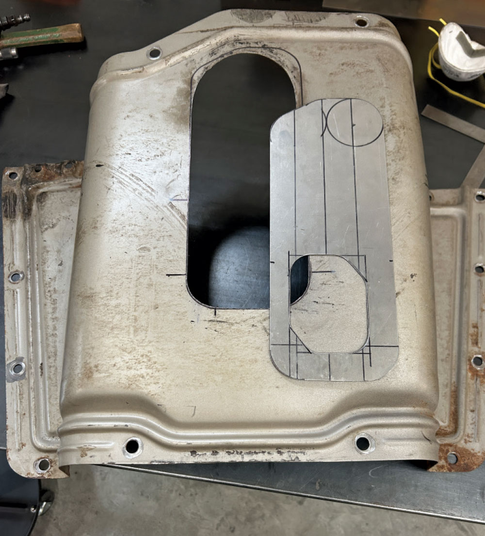 Transmission tunnel cover upside down, oval opening layout, workbench fabrication, Chevy C10