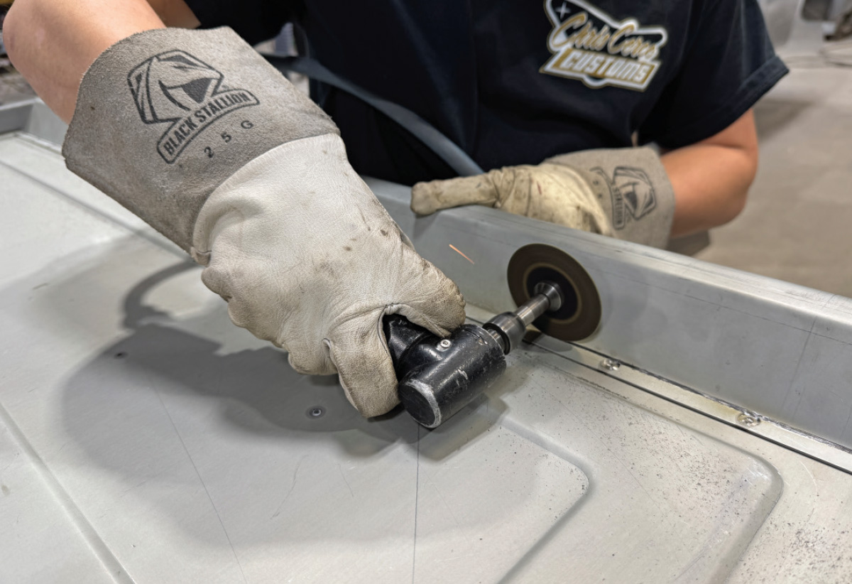 Grindingcutting tailgate edge, pneumatic cut-off wheel, BLACK STALLION 25G gloves, metal debris on surface