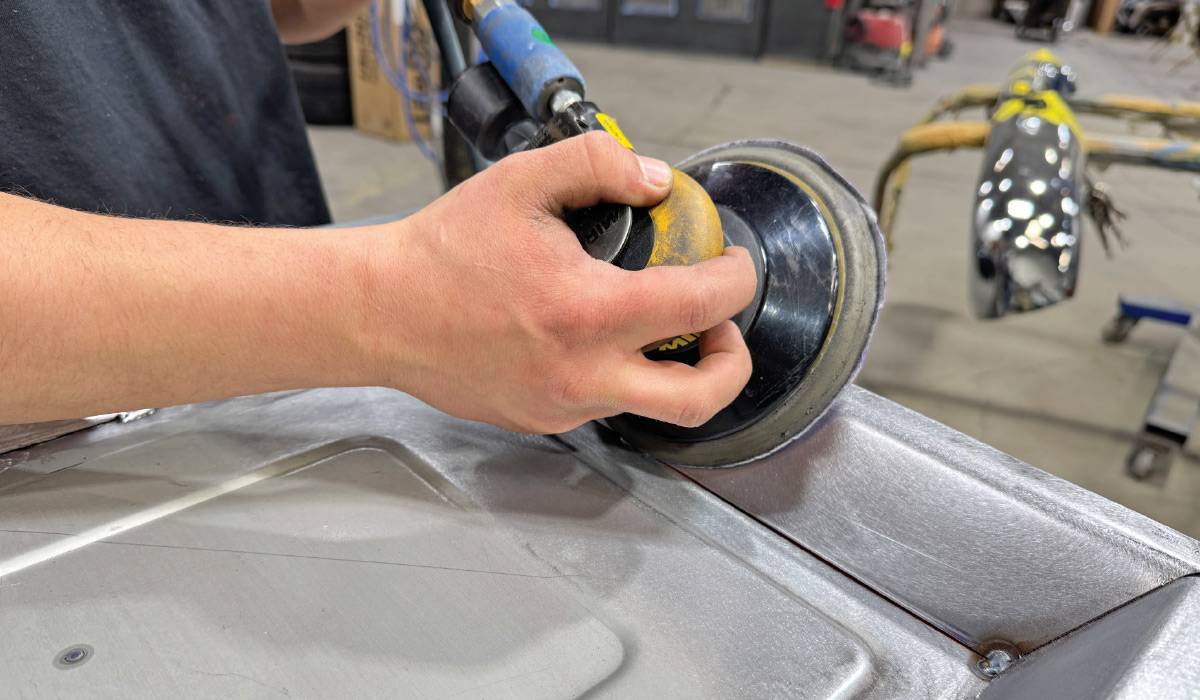 DA sanding blended seam, flush finish, Club Carce Customs shirt, taped chrome bumper behind